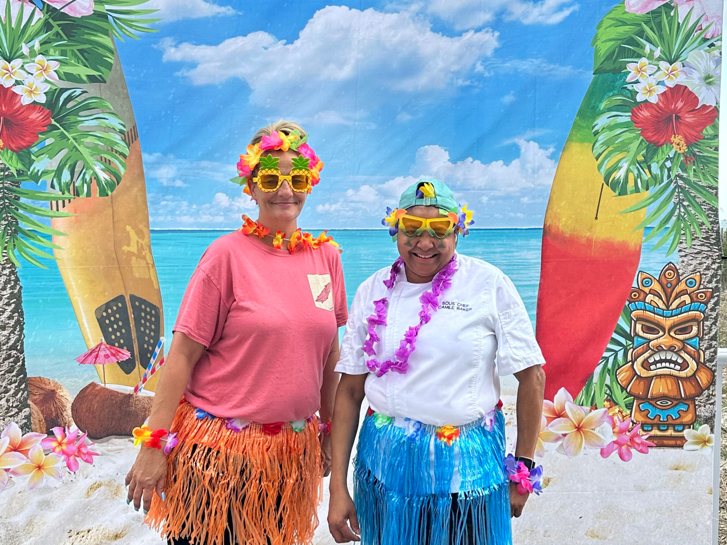 Two Team Members on Beach Deck Party